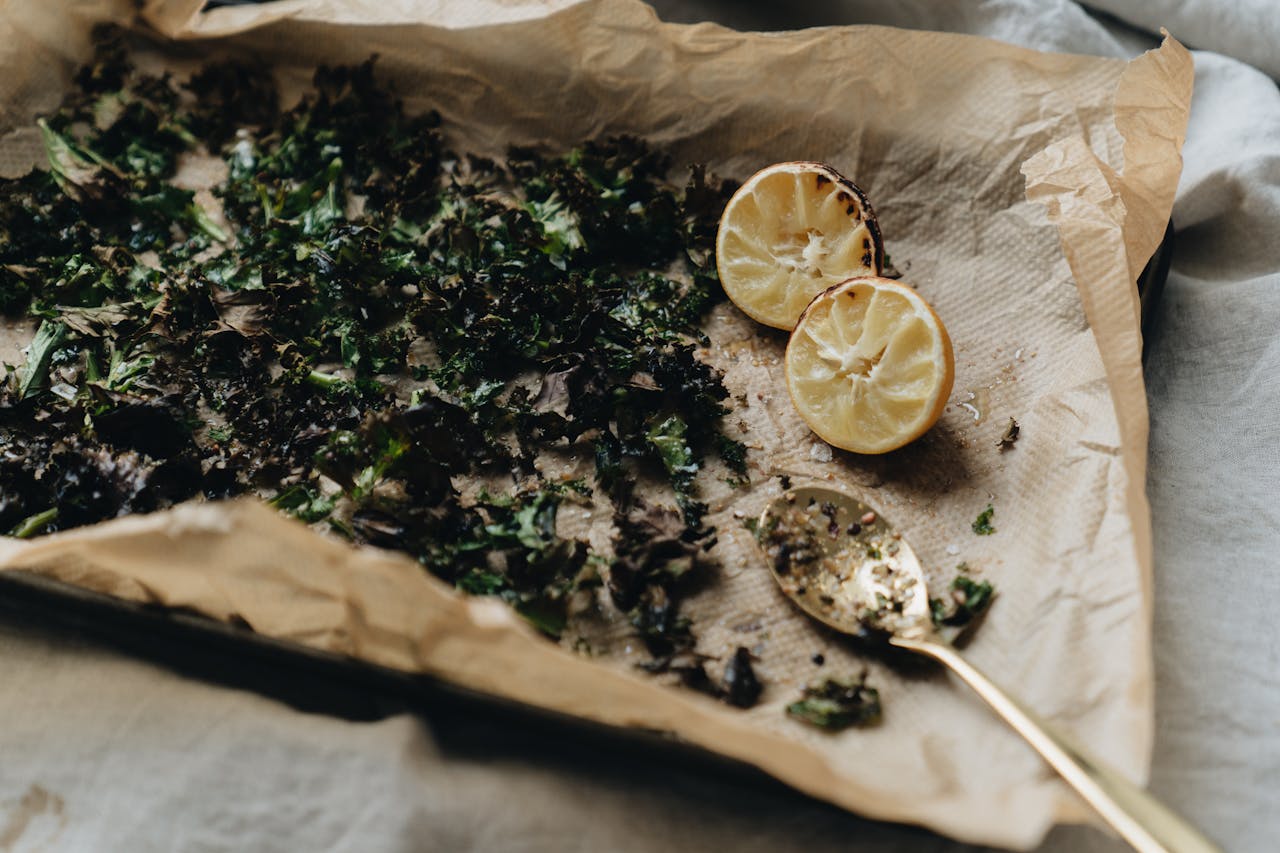 Crafting Captivating Headlines: Your awesome post title goes here A minimalistic image of roasted herbs and lemon halves on a lined baking sheet with a spoon.